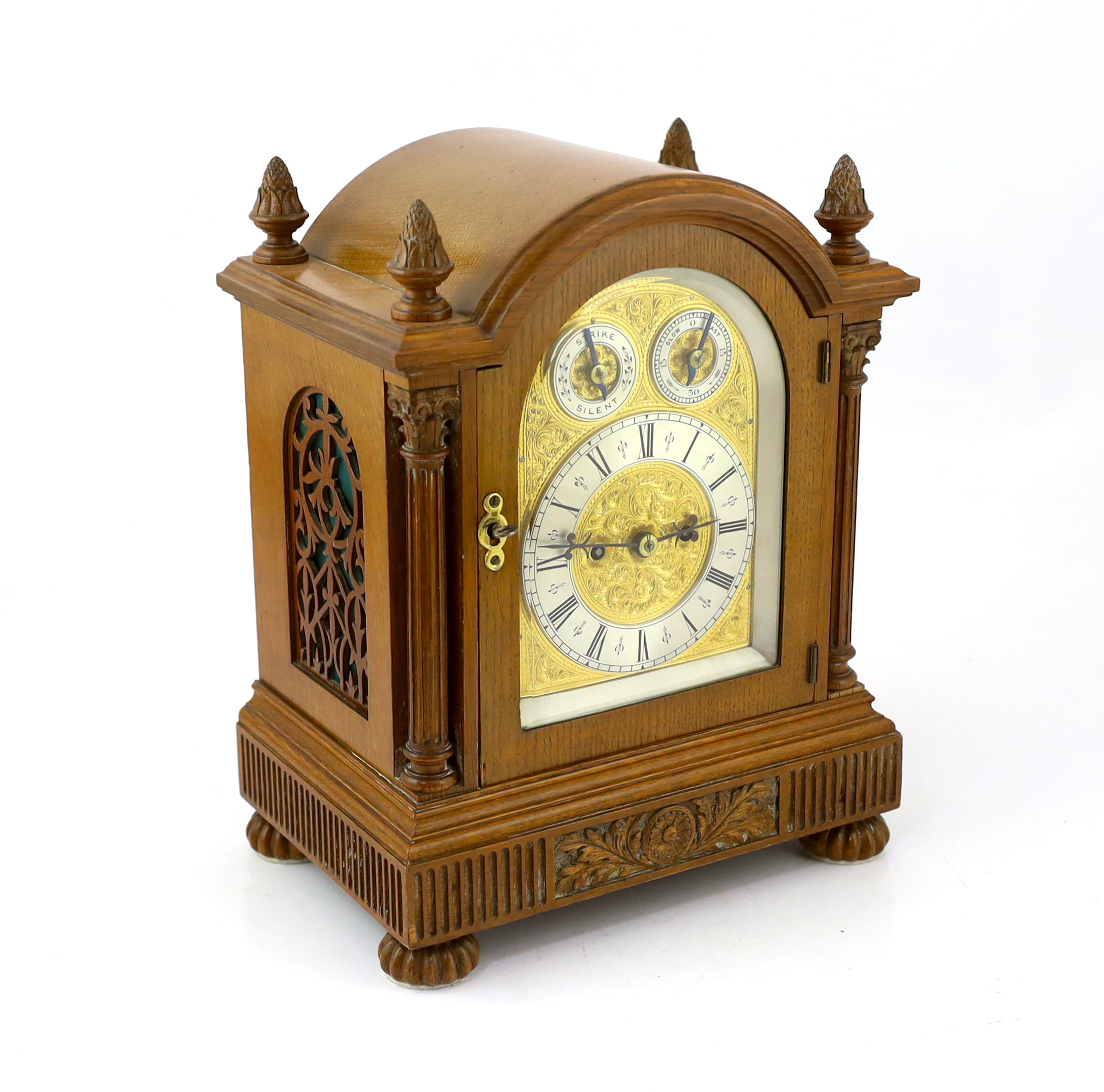 An Edwardian golden oak eight day bracket clock 28cm wide, 19cm deep, 36cm high